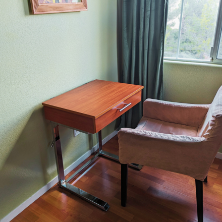 How to use a portable desk for laptop to create a dedicated workspace in a small space